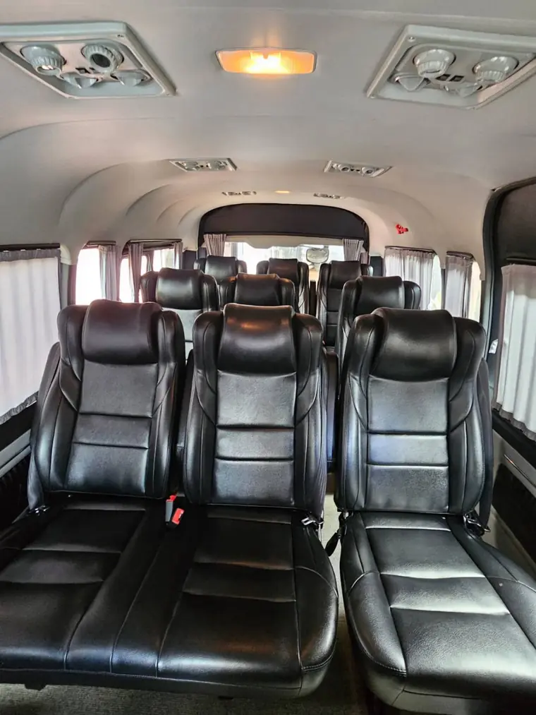 Clean and comfortable passenger seating inside a OneDD Tour van
