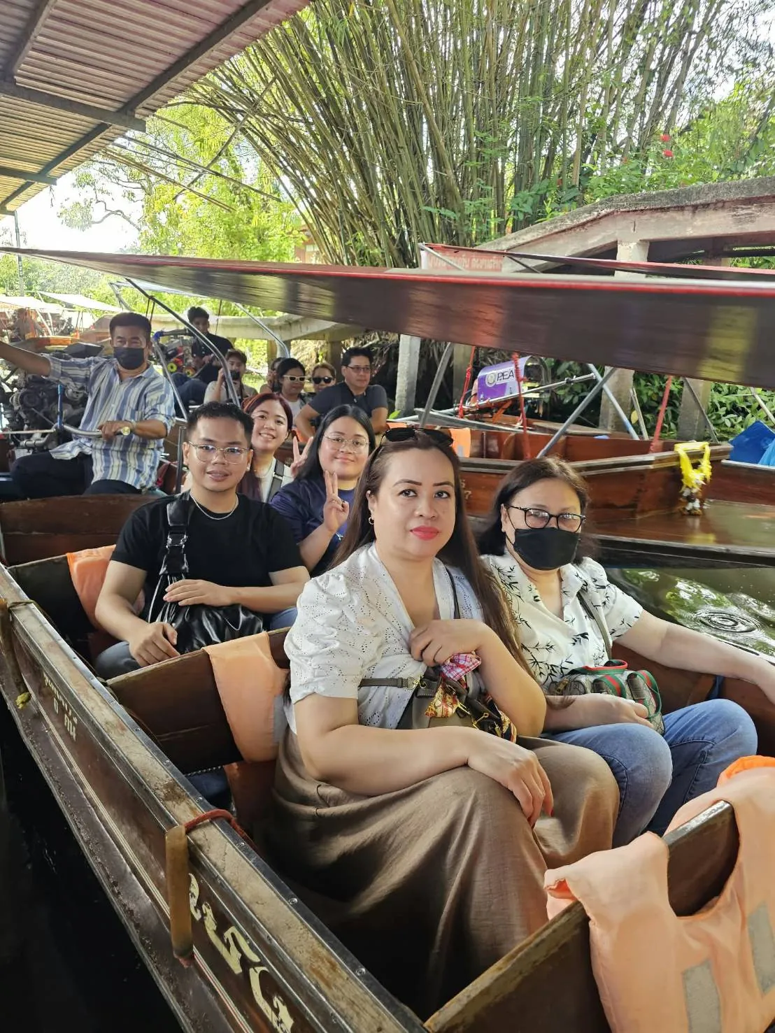Guests on a boat ride through the floating market — a trip with OneDD Tour by KrishHoliday